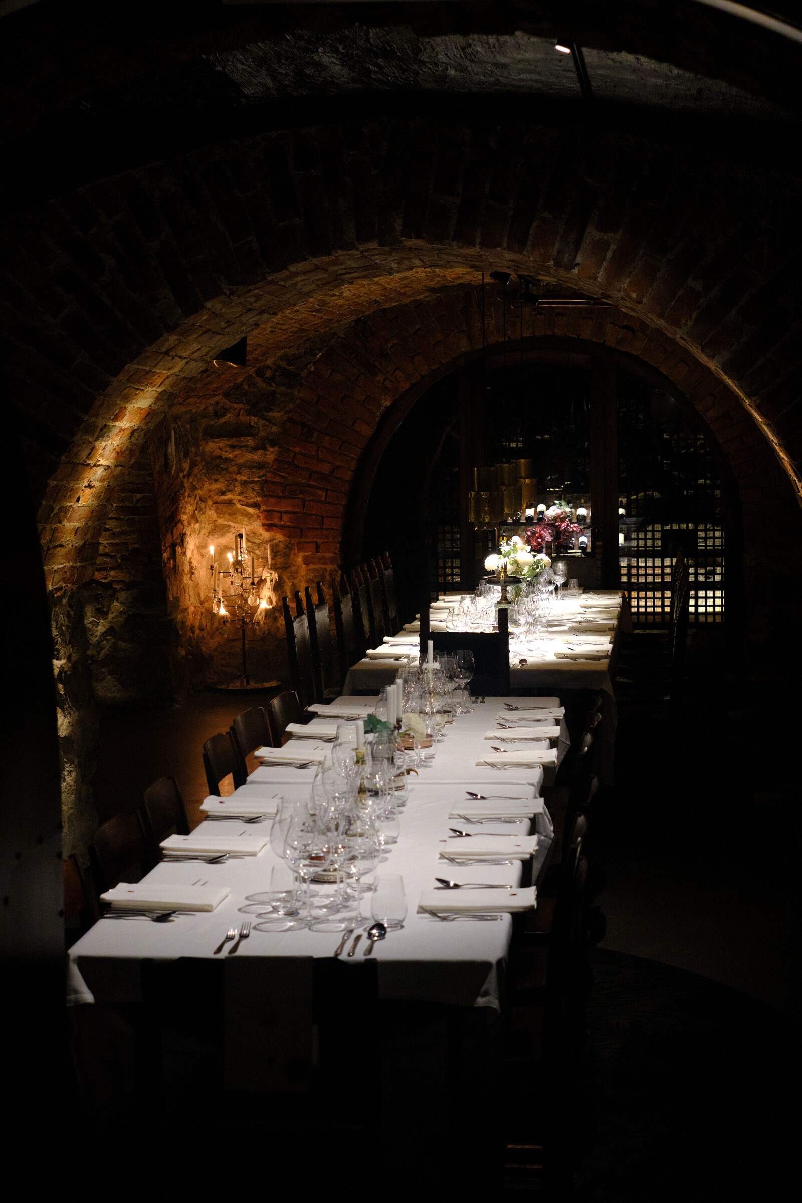 Kryptan, a set long table beneath the brick vault